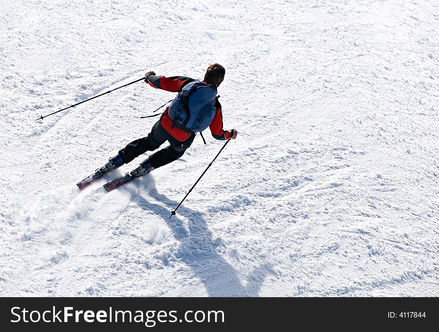 Skier man moving down