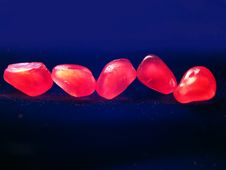 Five Red Grains Of A Pomegranate Royalty Free Stock Image