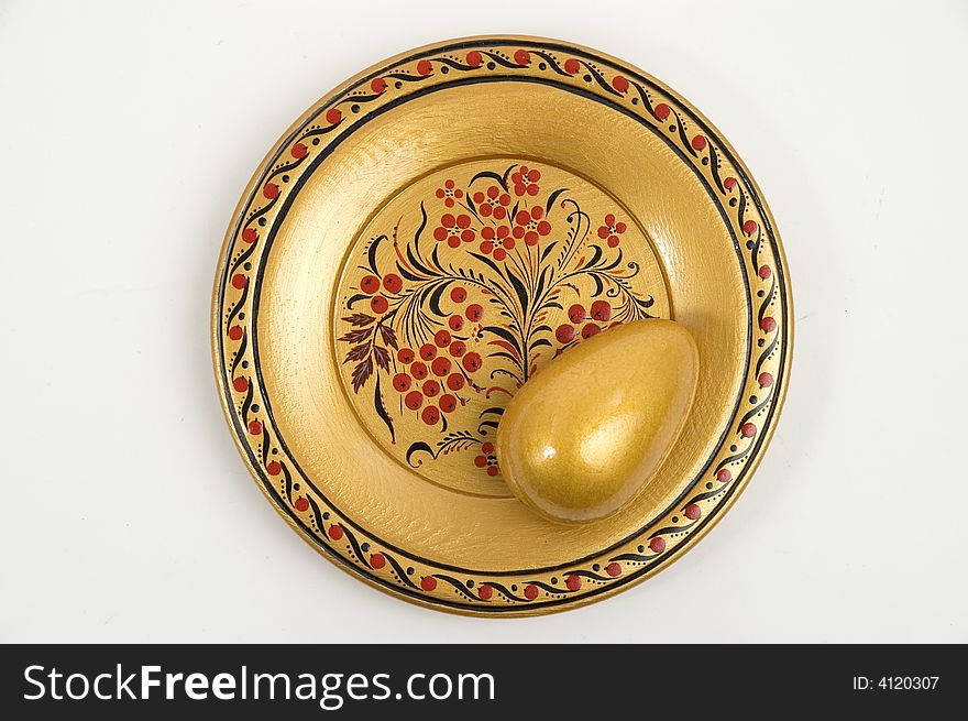 Colour wooden dish with figure and gold egg. Colour wooden dish with figure and gold egg.