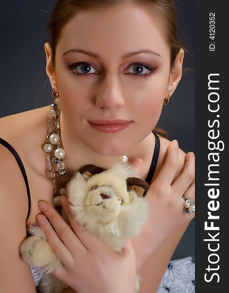 Lovely looking woman portrait holding toy