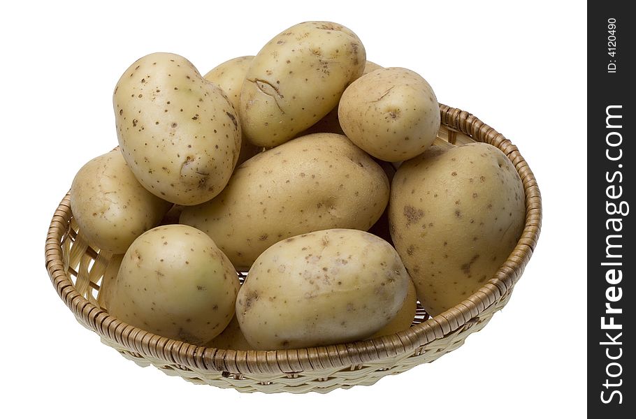 Potatoes on the wicker basket isolated