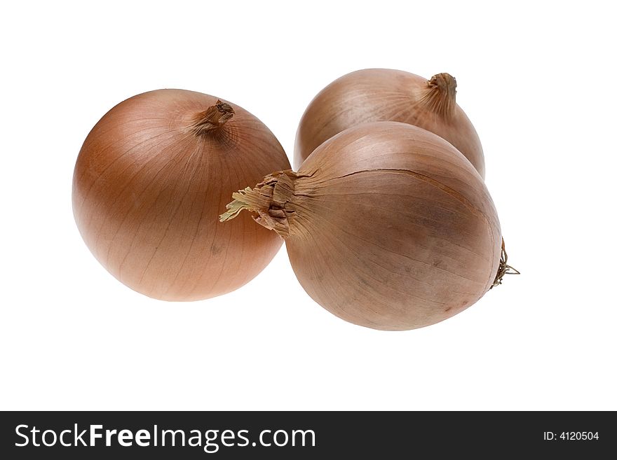 Three whole raw onions on the white backgrounds