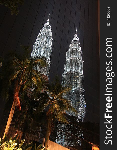Reflection of skyscraper in Kuala Lumpur at night