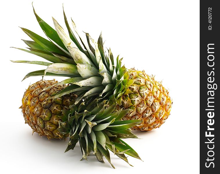 Two pineapples isolated on white background