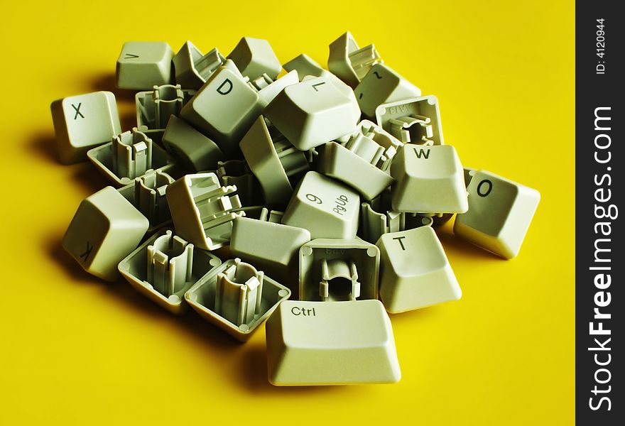 Computer keyboard letters on a yellow background