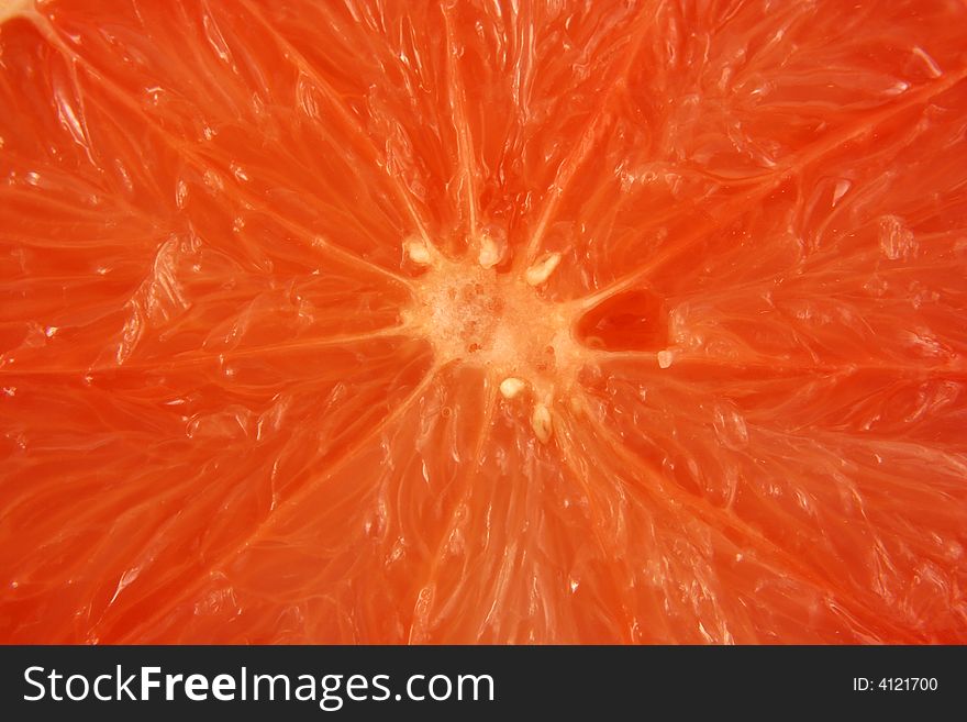 Pink grapefruit half background texture