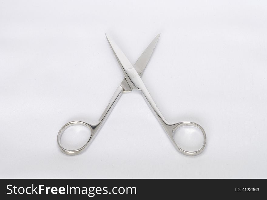 A pair of stainless steel scissors, great for cutting.