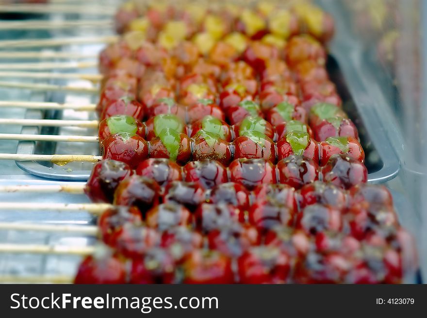 String of candied haws,Tanghulu, a traditional hibernal appetizer in China. String of candied haws,Tanghulu, a traditional hibernal appetizer in China.