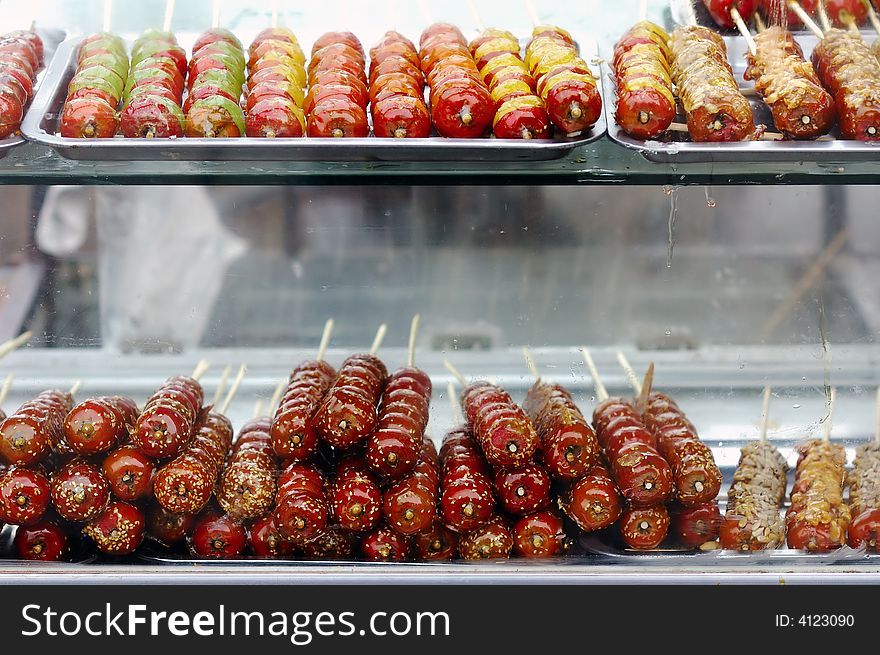 String of candied haws,Tanghulu, a traditional hibernal appetizer in China. String of candied haws,Tanghulu, a traditional hibernal appetizer in China.