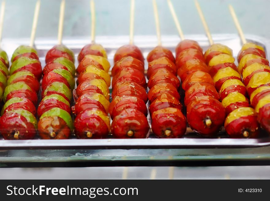 String of candied haws,Tanghulu, a traditional hibernal appetizer in China. String of candied haws,Tanghulu, a traditional hibernal appetizer in China.