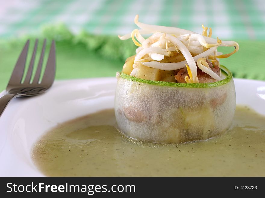 Cucumber wrapped chicken and potato chunks, topped with mung bean sprouts in cucumber sauce. Cucumber wrapped chicken and potato chunks, topped with mung bean sprouts in cucumber sauce