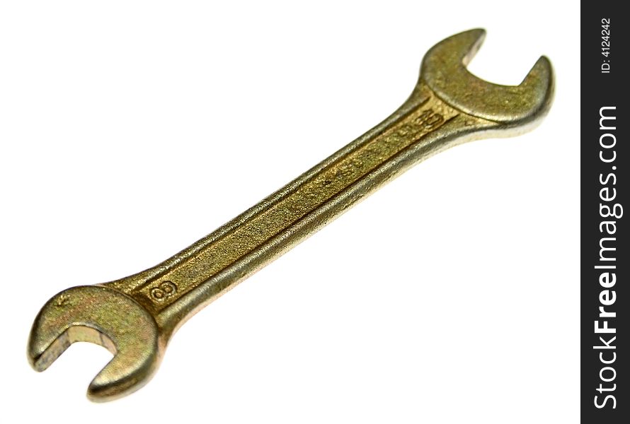 Golden spanner over white background.