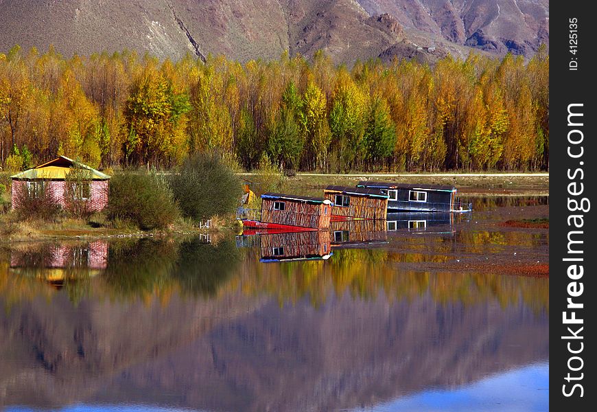 Reflection of colorful scene by the water