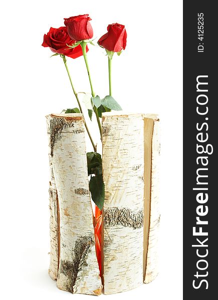 Roses in a wooden vase