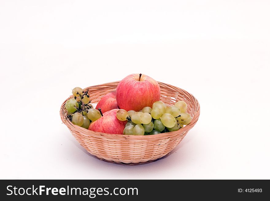 Basket with fruits, isolated on white background