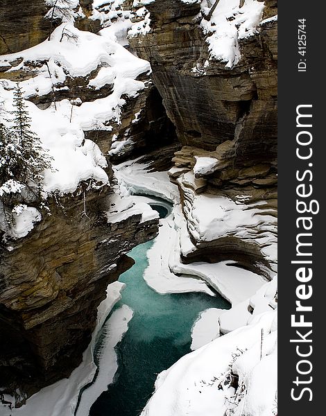 Partially frozen river, by Athabasca falls in Jasper Alberta. Partially frozen river, by Athabasca falls in Jasper Alberta