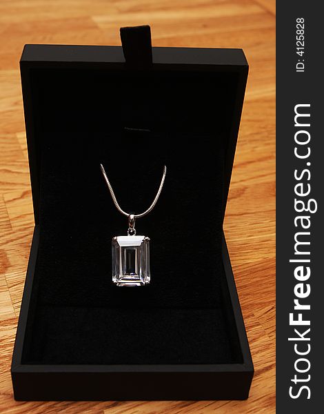 Diamond necklace in an open  black box