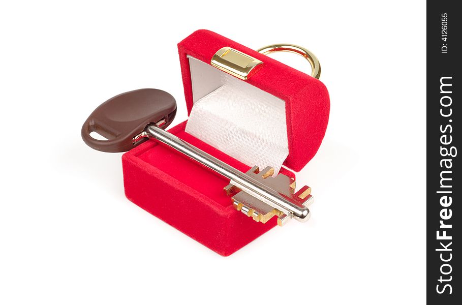 Red present box with steel key isolated over white. Red present box with steel key isolated over white