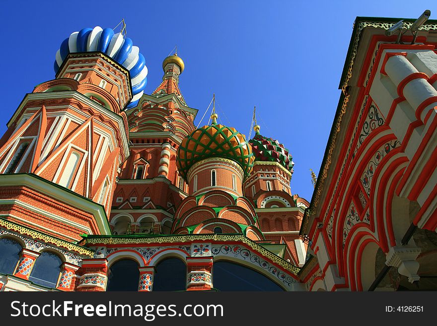 Multi-coloured domes of bright fairy church, red brick, Moscow. Multi-coloured domes of bright fairy church, red brick, Moscow