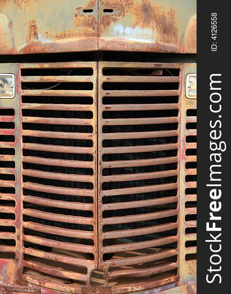 Detail of the grill on an old rusted mine truck. Detail of the grill on an old rusted mine truck