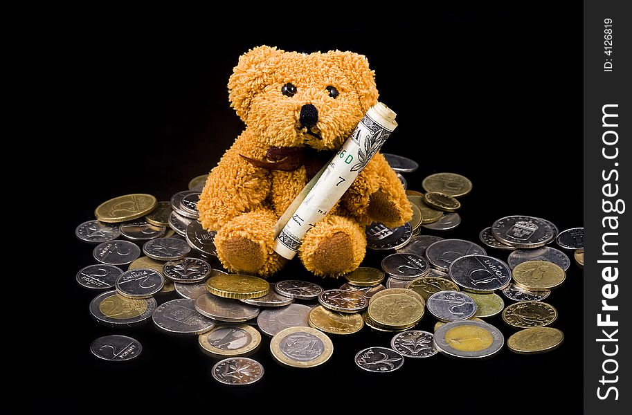 Teddy bear carrying Dollar Bill