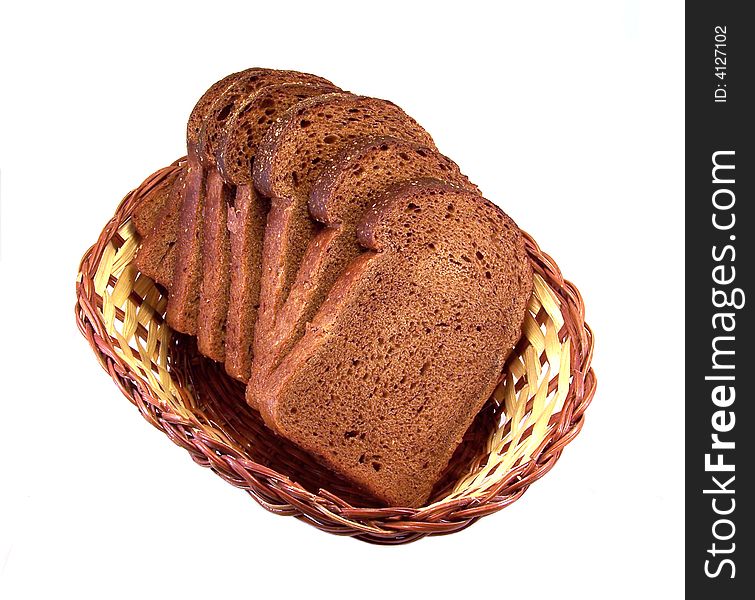 Slices of rye-bread in basket on white background
