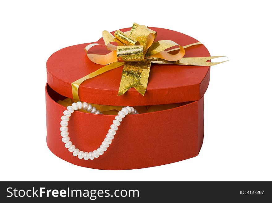 Heart shape box with pearl necklace and gold ribbon. Heart shape box with pearl necklace and gold ribbon