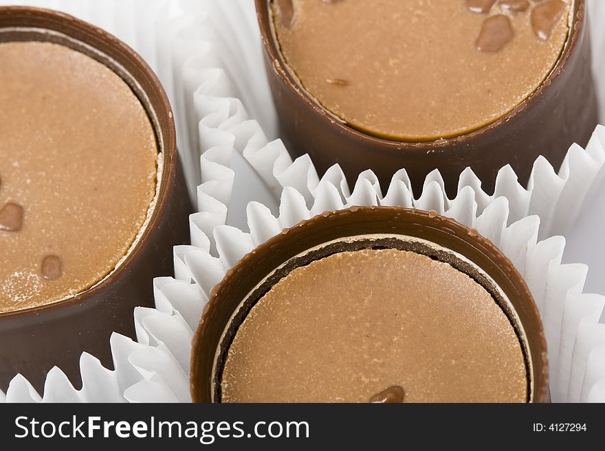 Three chocolate sweet candies closeup