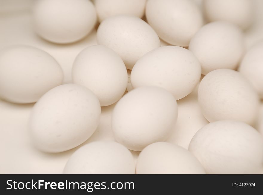 Grouping of eggs on a tiled kitchen counter