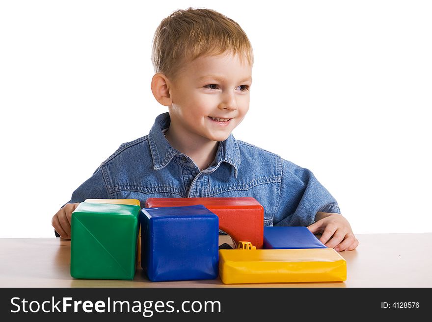 Child plays with colour blocks. Child plays with colour blocks