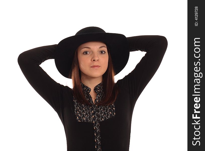 Portrait of the girl in a black hat. Isolated