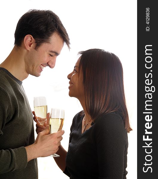 Young man and woman celebrate their engagement with champagne. Young man and woman celebrate their engagement with champagne.