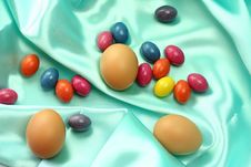 Easter Eggs On Turquoise Satin Fabric Stock Photo Easter Eggs On Turquoise Satin Fabric Stock Photo