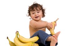 Baby With Banana. Stock Photo