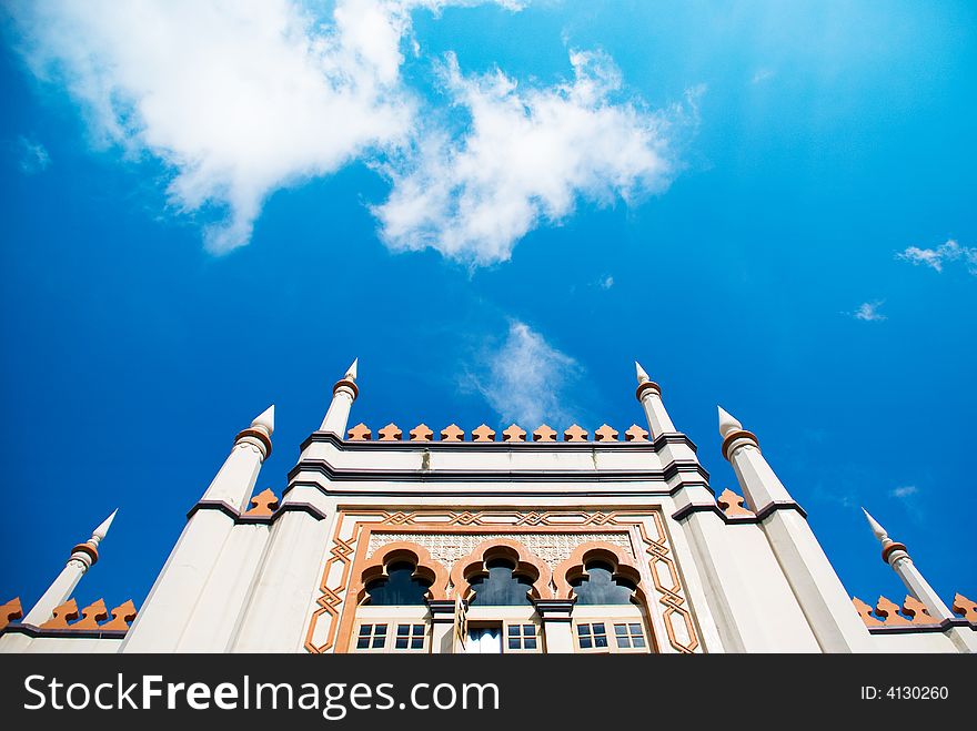 Historical mosque in the historic Malay district in Singapore, against a bright blue morning sky. Historical mosque in the historic Malay district in Singapore, against a bright blue morning sky.