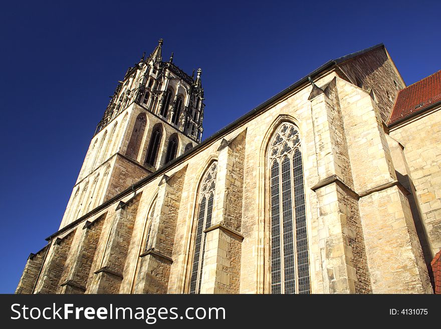 Church in Munster, Germany from below with blue sky