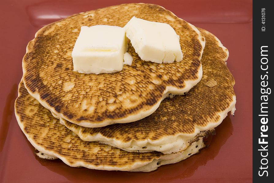 Close-up of stack of pancakes with butter. Close-up of stack of pancakes with butter.