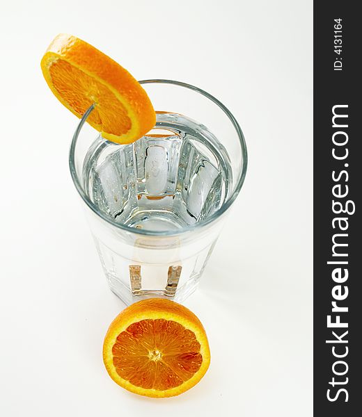 Glass of pure water with orange slices. Glass of pure water with orange slices