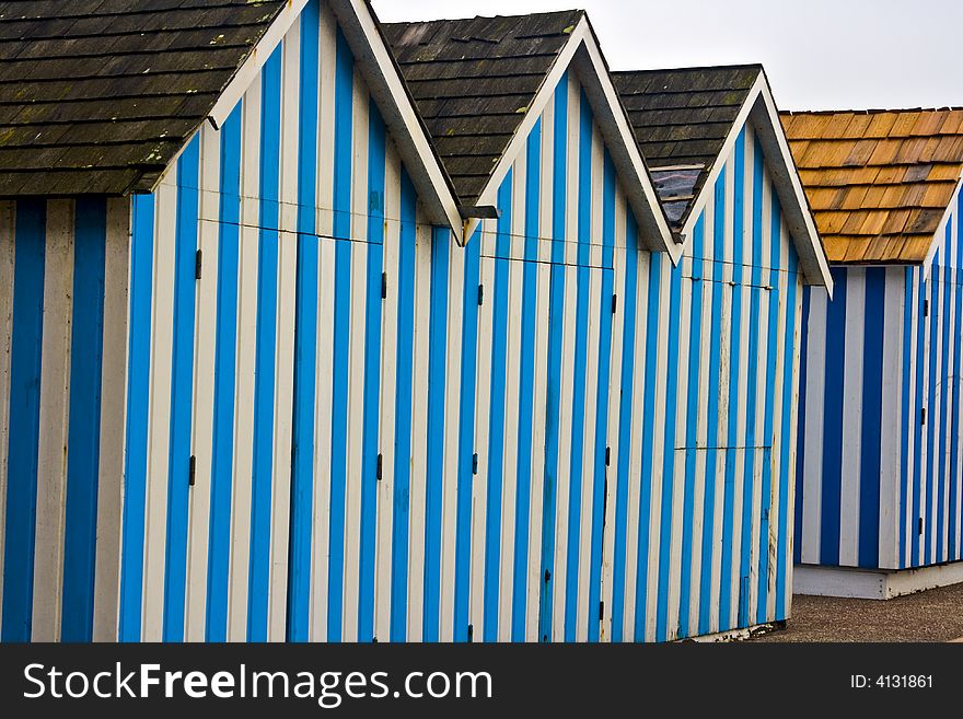 Blue Cabanas at the beach in Normandy France