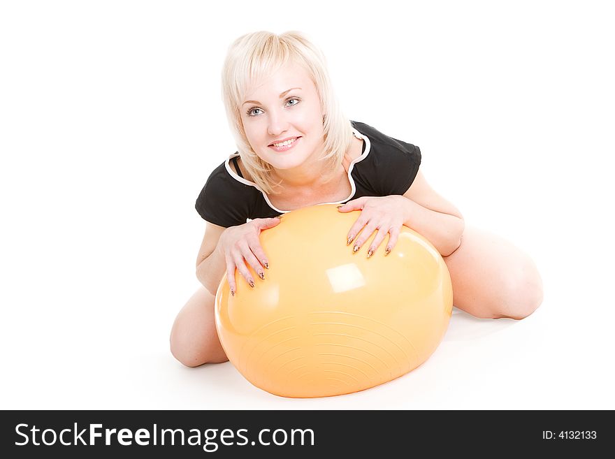 A Beautiful Blond Girl With A Fitness Ball On The