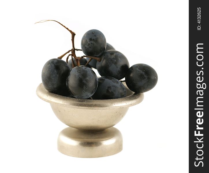 Bunch of grape in a metal vase