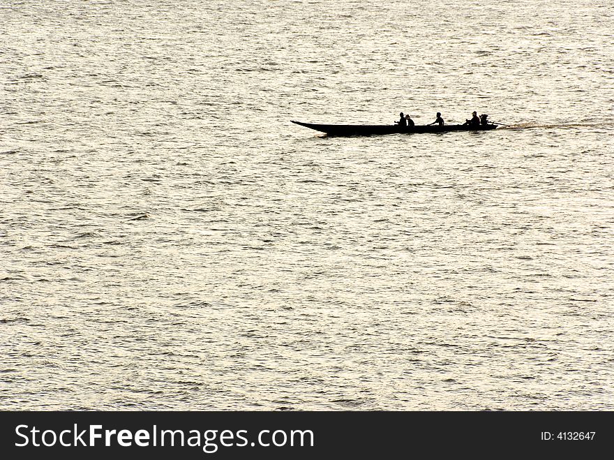 Small boat silhouette on a river. Small boat silhouette on a river