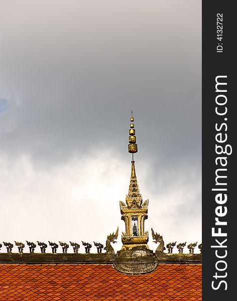 Buddhist temple roof with decoration and dark sky