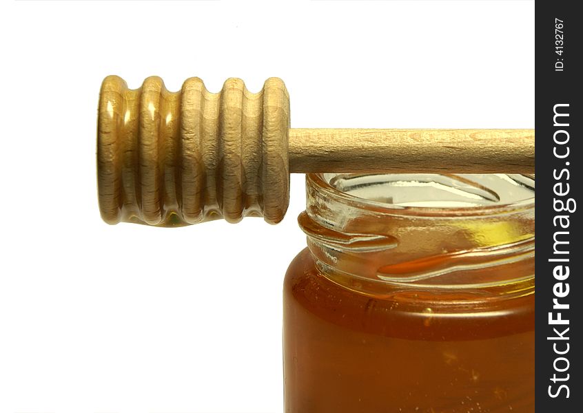 Detail of isolated jar with honey.