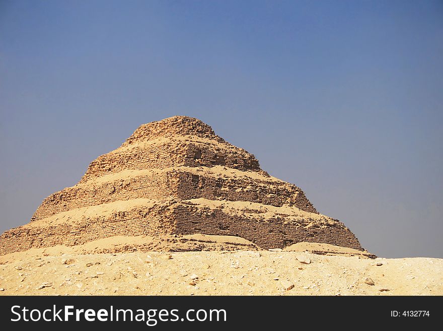 Ancient step pyramid of Djoser (Zoser) at Saqqara plateau, Egypt, near Cairo. Ancient step pyramid of Djoser (Zoser) at Saqqara plateau, Egypt, near Cairo