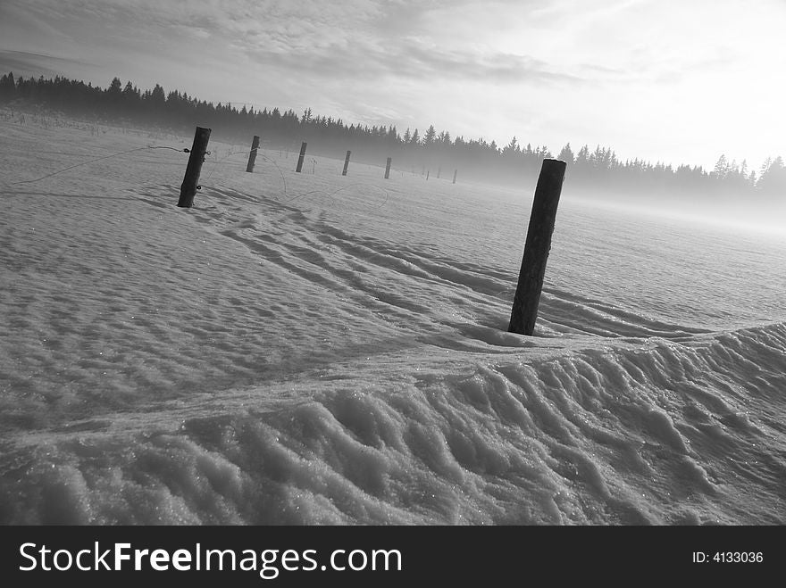 Monochrome landscape of snow covered field. Monochrome landscape of snow covered field.