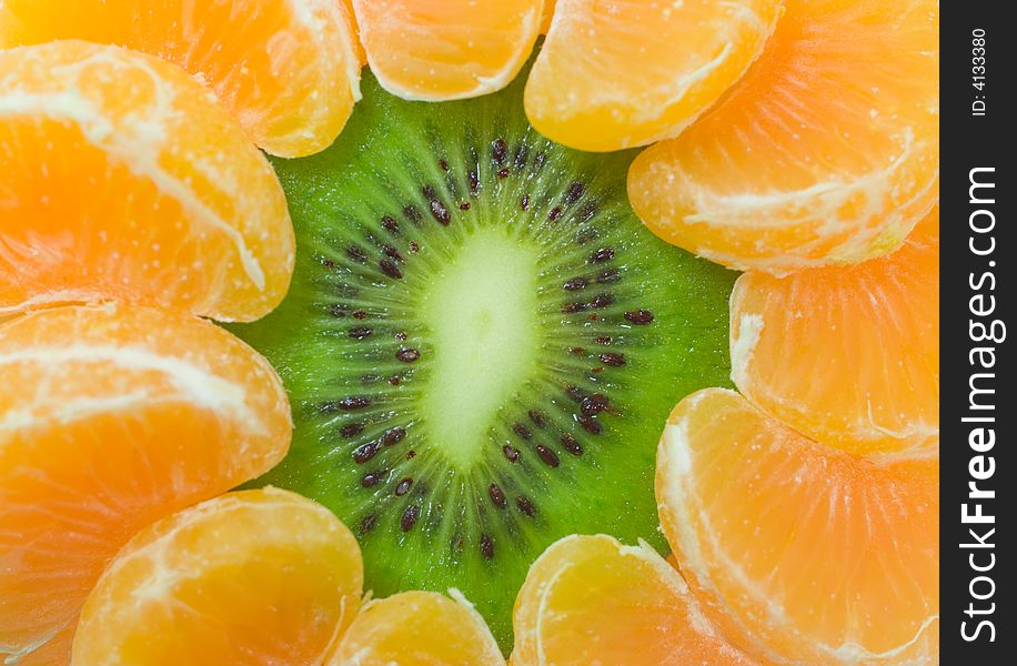 Close-up kiwi and tangerine slices as flower. Close-up kiwi and tangerine slices as flower