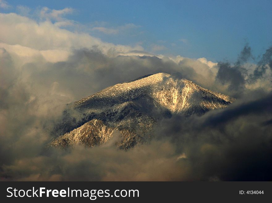 San bernardino peak covered with snow and clouds. San bernardino peak covered with snow and clouds