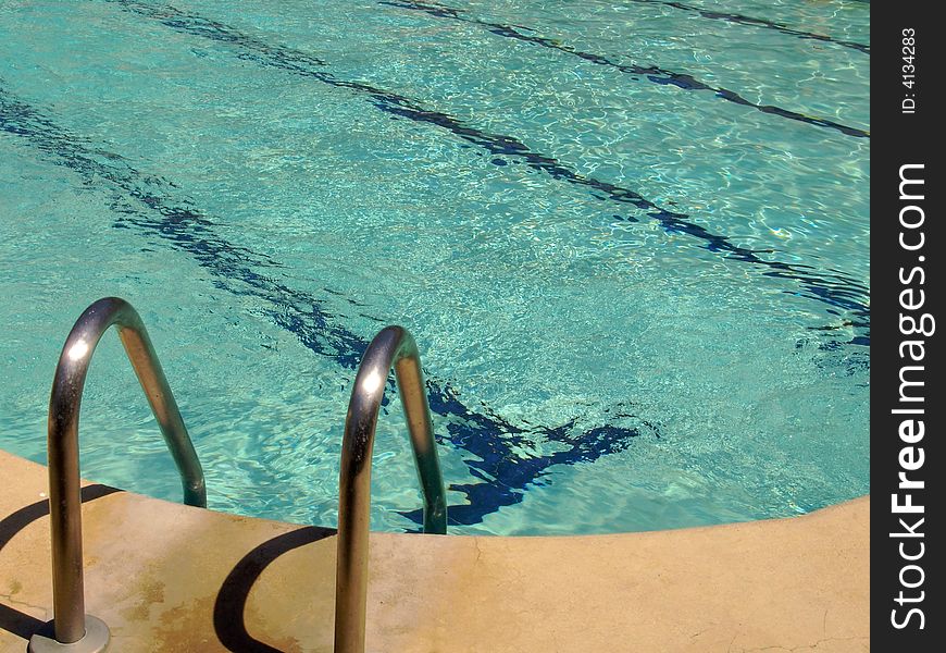 Swimming Pool with Turquoise Rippling Water. Swimming Pool with Turquoise Rippling Water