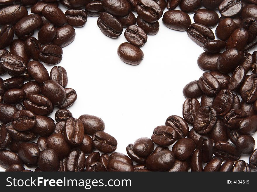 Coffee beans in a shape of a heart. Coffee beans in a shape of a heart.